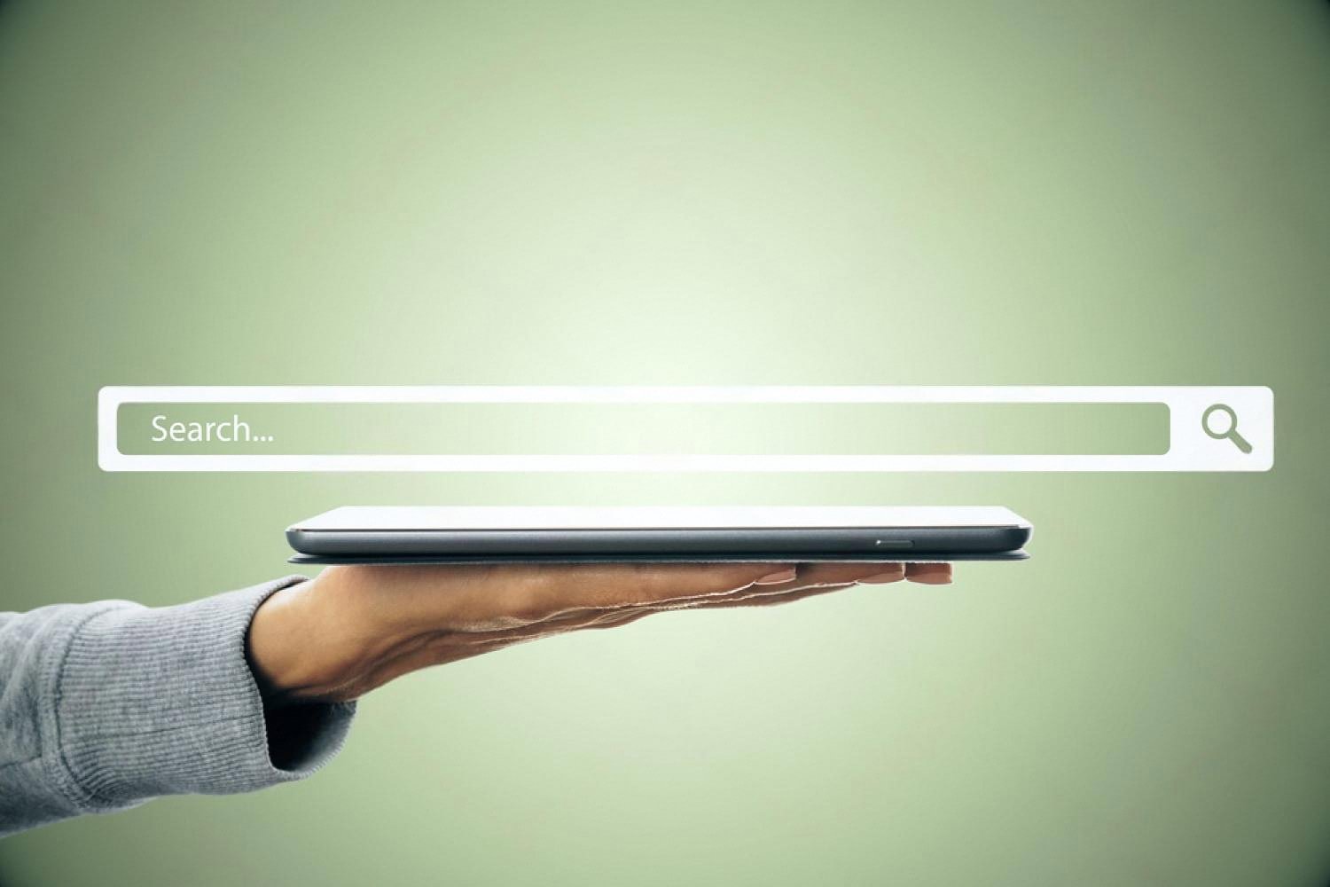 Hand holding a smartphone under a floating search bar representing short memorable domains